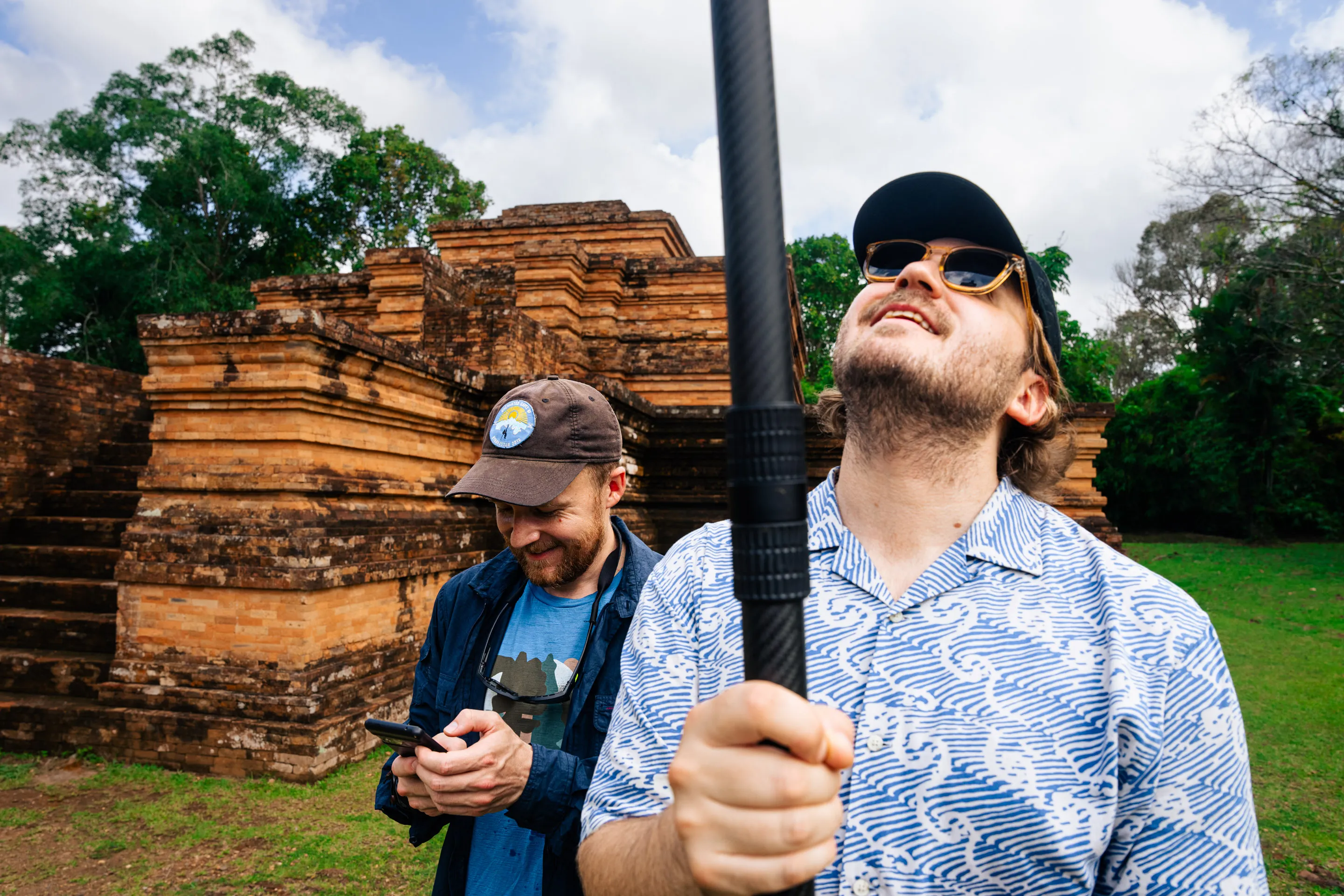 Field team photographing the temple site in Muarajambi