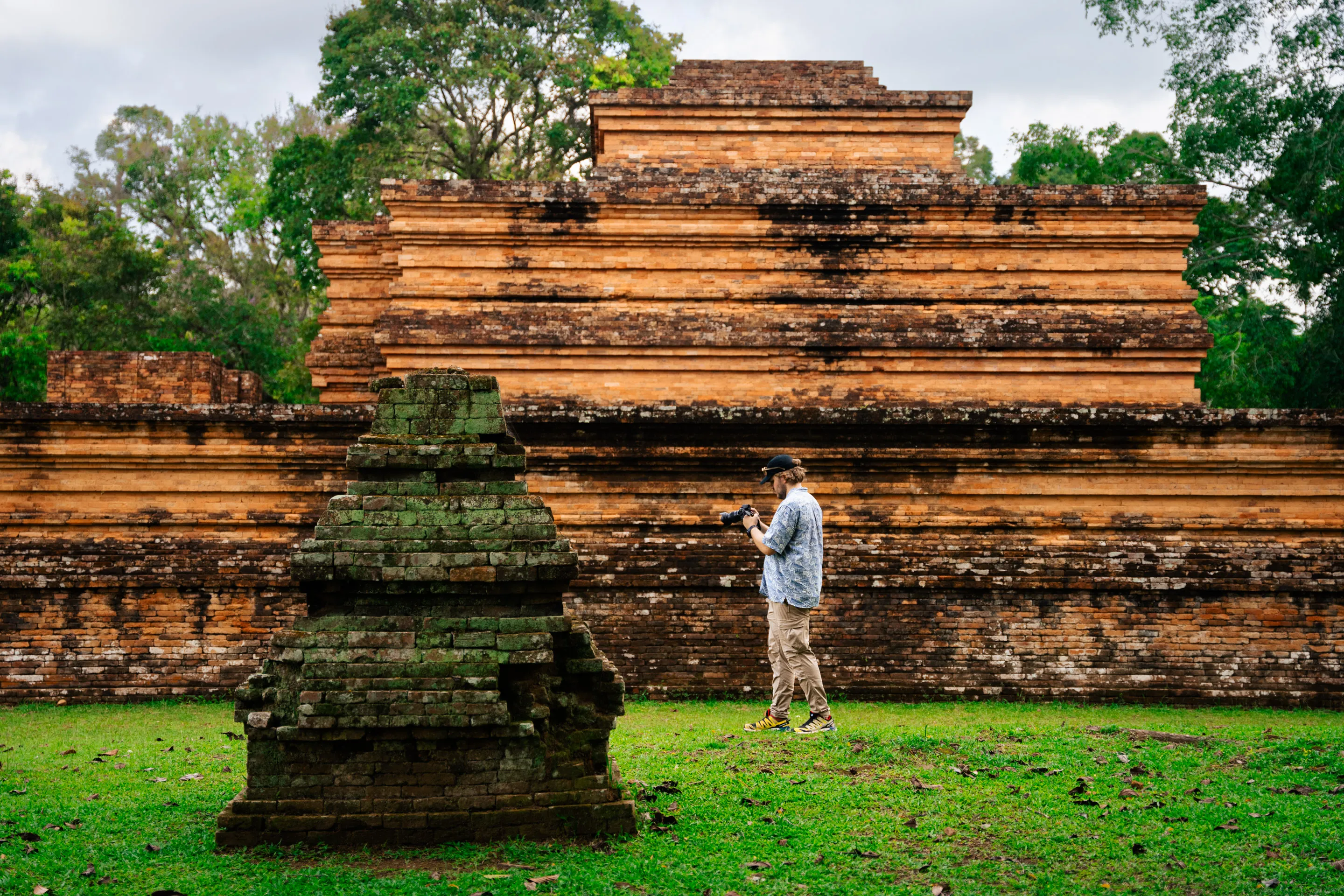 Team members navigating the temple grounds during fieldwork