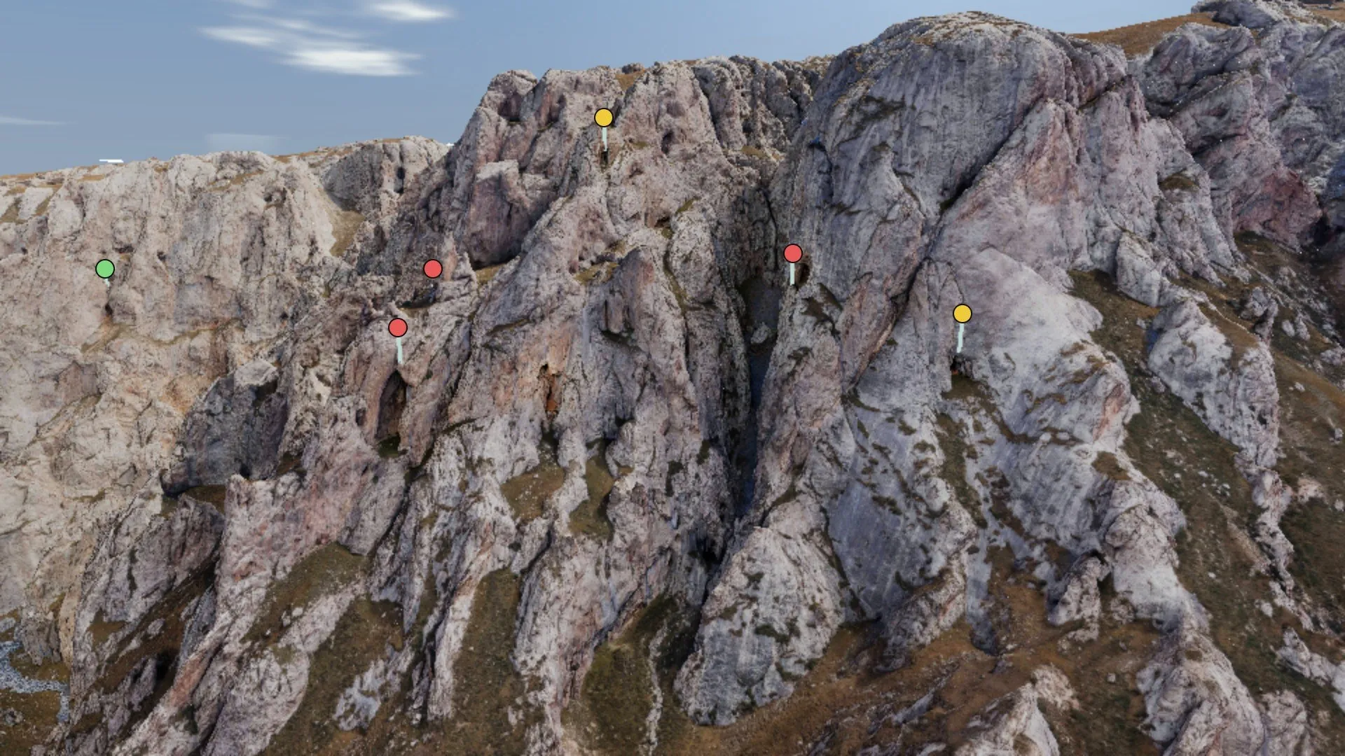 The cliffs of Kok-Kiya in the Tien Shan, scanned from the air, with tagged cave mouths